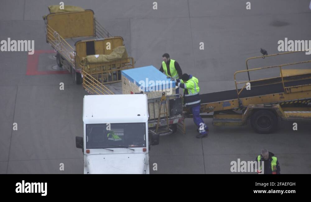Baggage Handlers Offloading Containers From Plane Sony A7sII ...