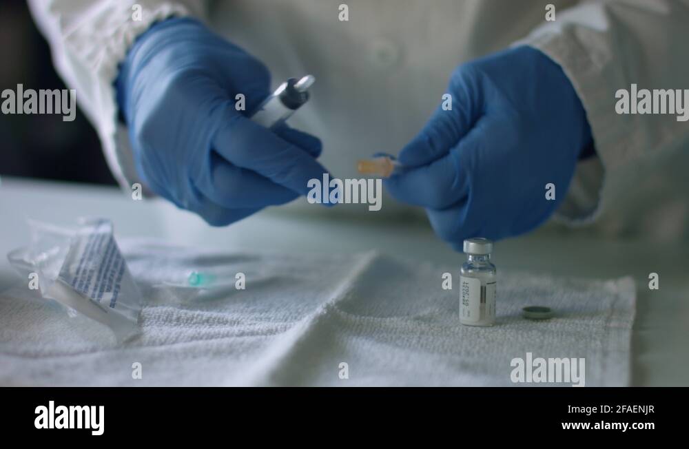 Nurse assemble needle of a syringe for injection Stock Video Footage
