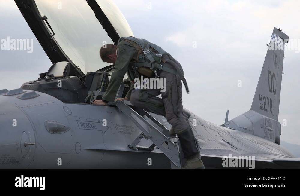 Pilot descends cockpit ladder of F16 Fighting Falcon Stock Video