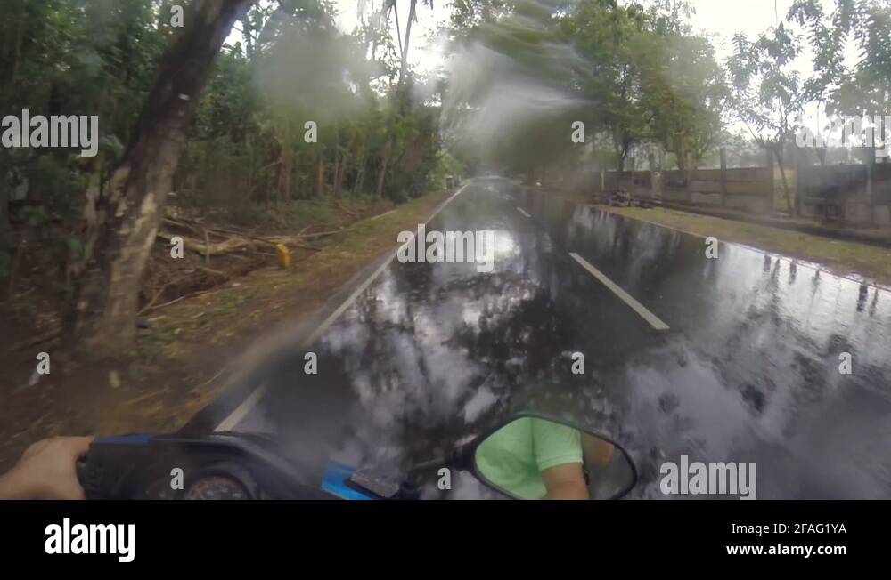 POV of Driving a Vespa in the rain in Ubud Bali Indonesia Stock Video