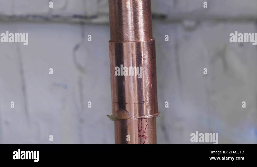 A copper pipe is welded using solder and a propane torch. Extreme