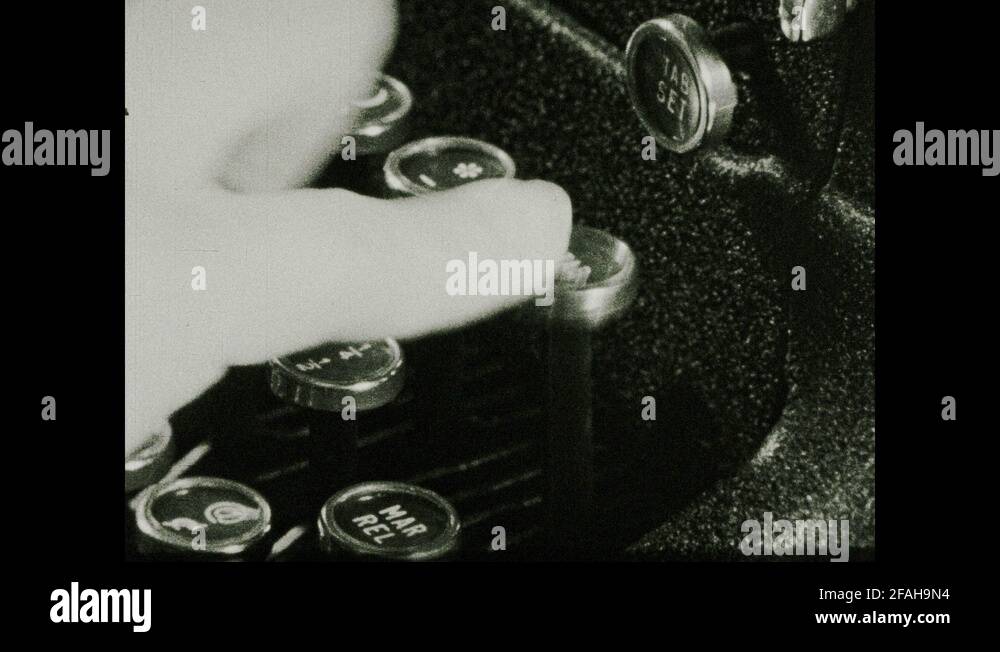 1930s Finger presses "Tab" key on a typewriter. Typewriter's type