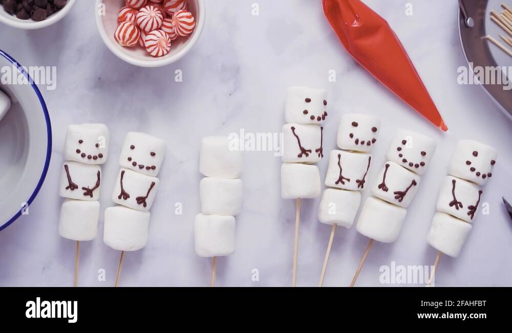 https://c8.alamy.com/comp/2fahfbt/making-marshmallow-snowman-and-reindeer-on-sticks-hot-chocolate-2fahfbt.jpg