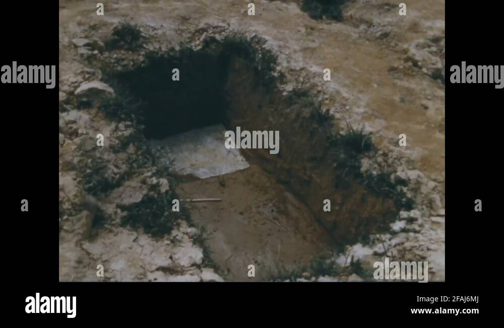 Graveyards dug for burial of dead bodies 1969 Stock Video Footage Alamy