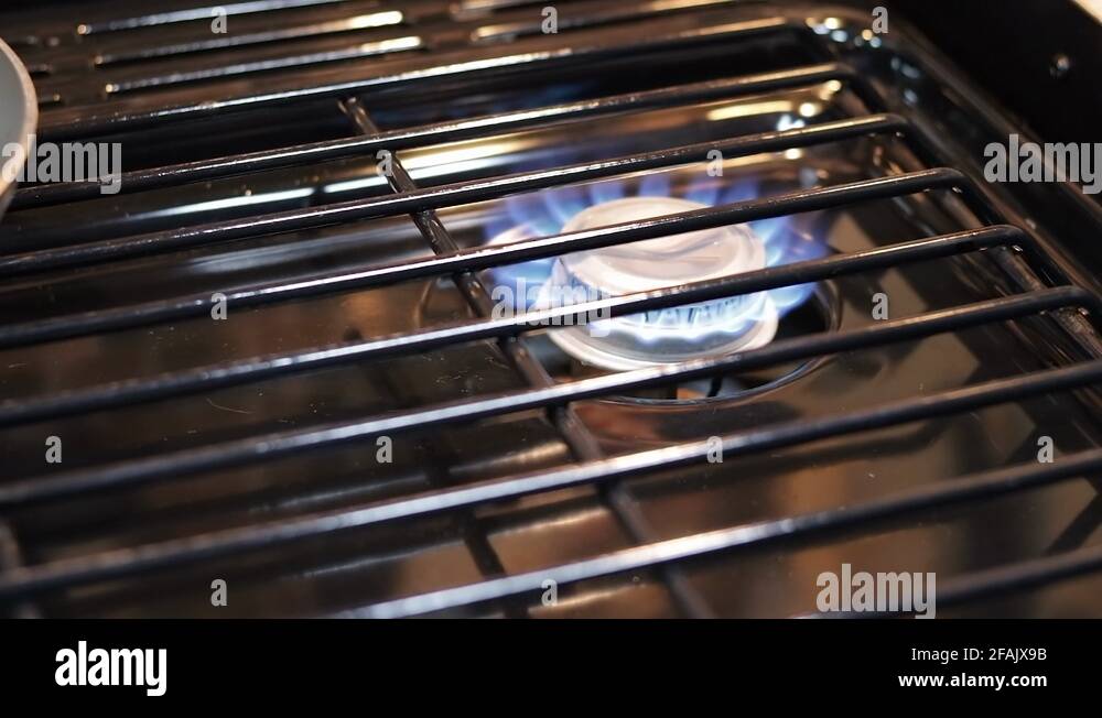 Gas Burner Turning On With A Blue Flame Close Up Stock Video Footage