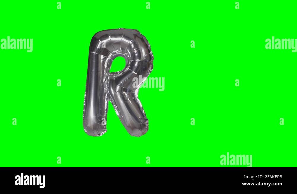 Big Letter R from alphabet helium silver balloon floating on green ...