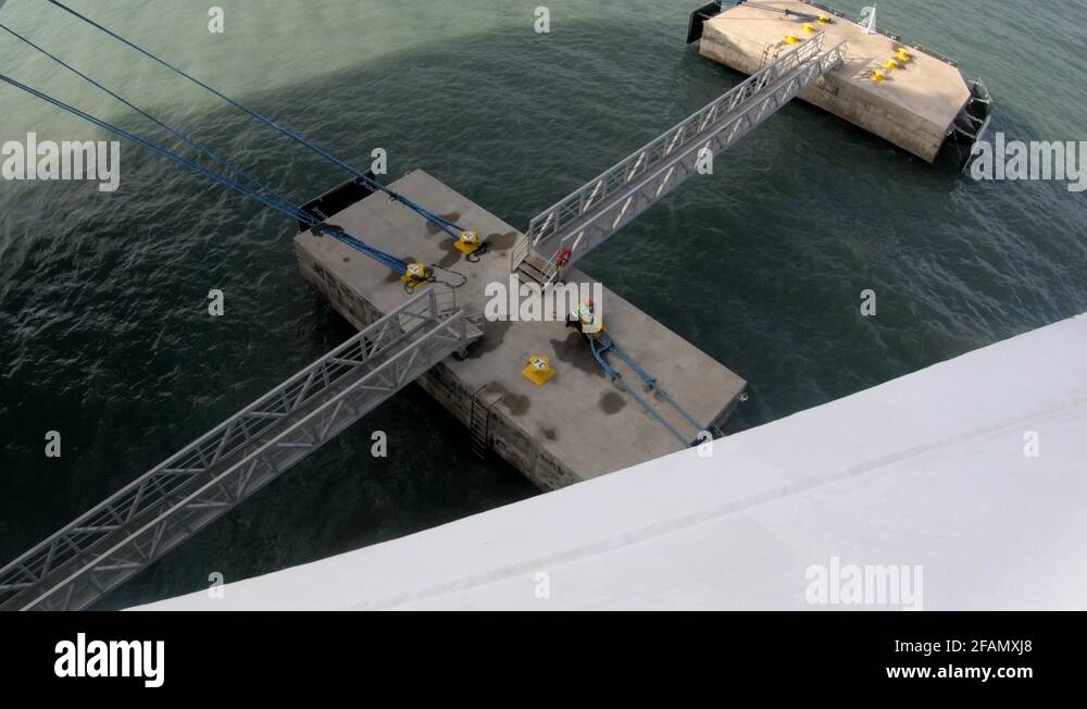 4k Deck hand releasing rope from cruise ship from dock Stock Video ...