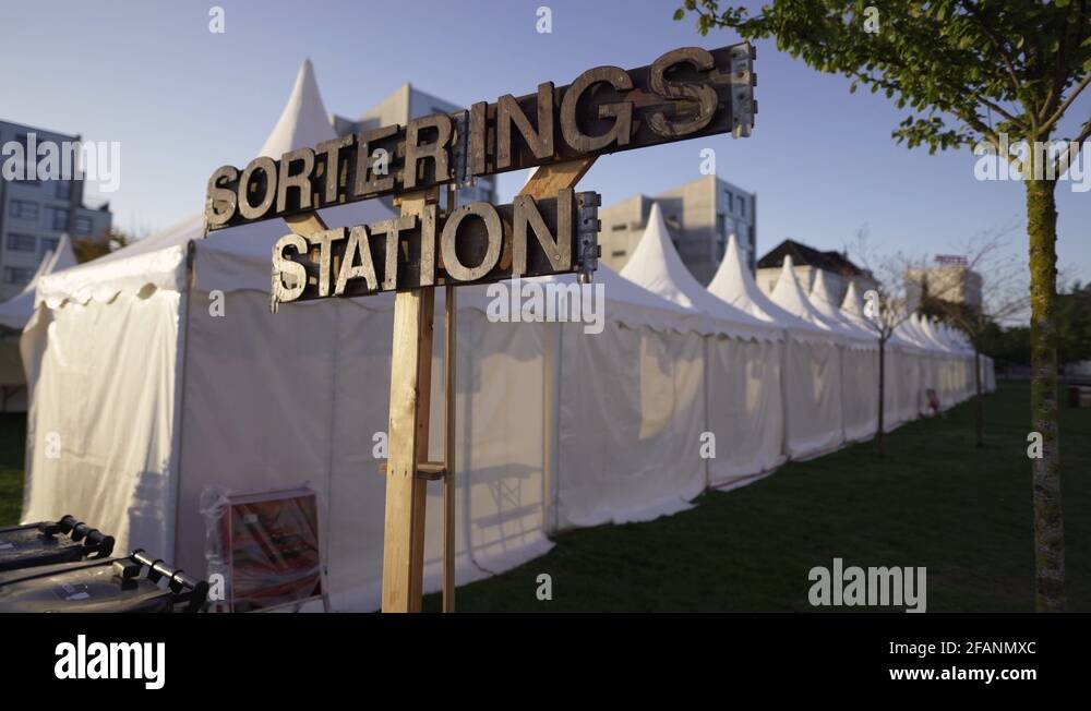 A sign for garbage sorting station at a sustainability festival in ...