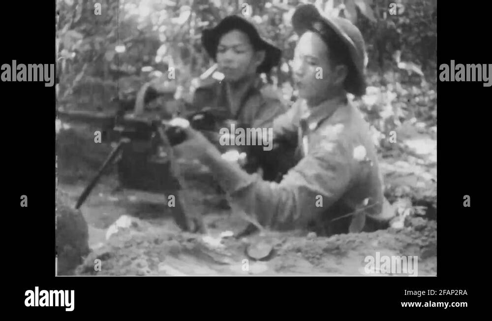 Viet Cong setting up machine gun at foxhole 1967 Stock Video Footage