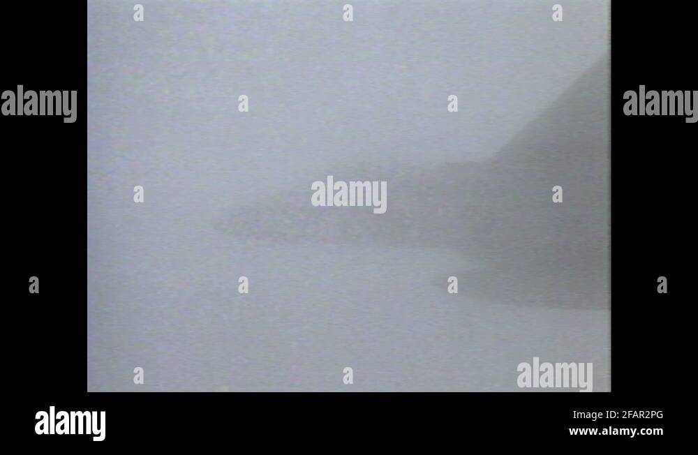 1990s: Fighter jet climbs in sky. Jet enters sites of targeting ...