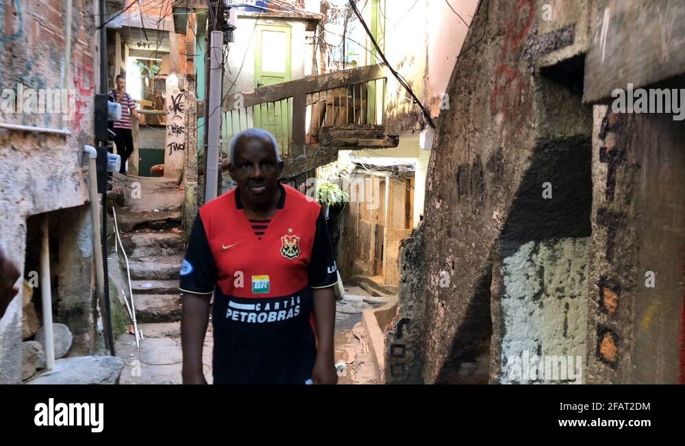 Man walking through the alleys of Rocinha in Rio de Janeiro, Brazil
