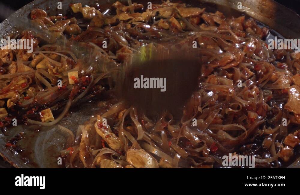 Cooking Authentic Traditional Thai Dish Pad Thai at Asian Street Night