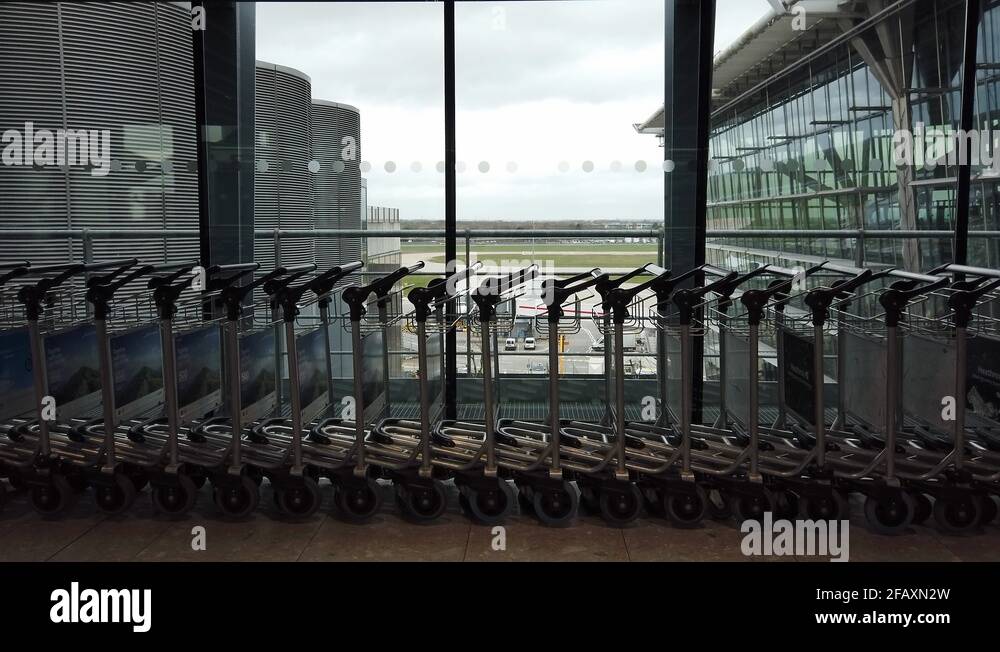 Luggage trolleys at terminal 5 of heathrow airport Stock Videos