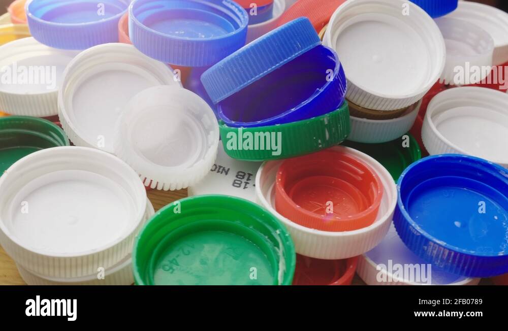 Many plastic bottle caps. Recyclable and recyclable plastic waste