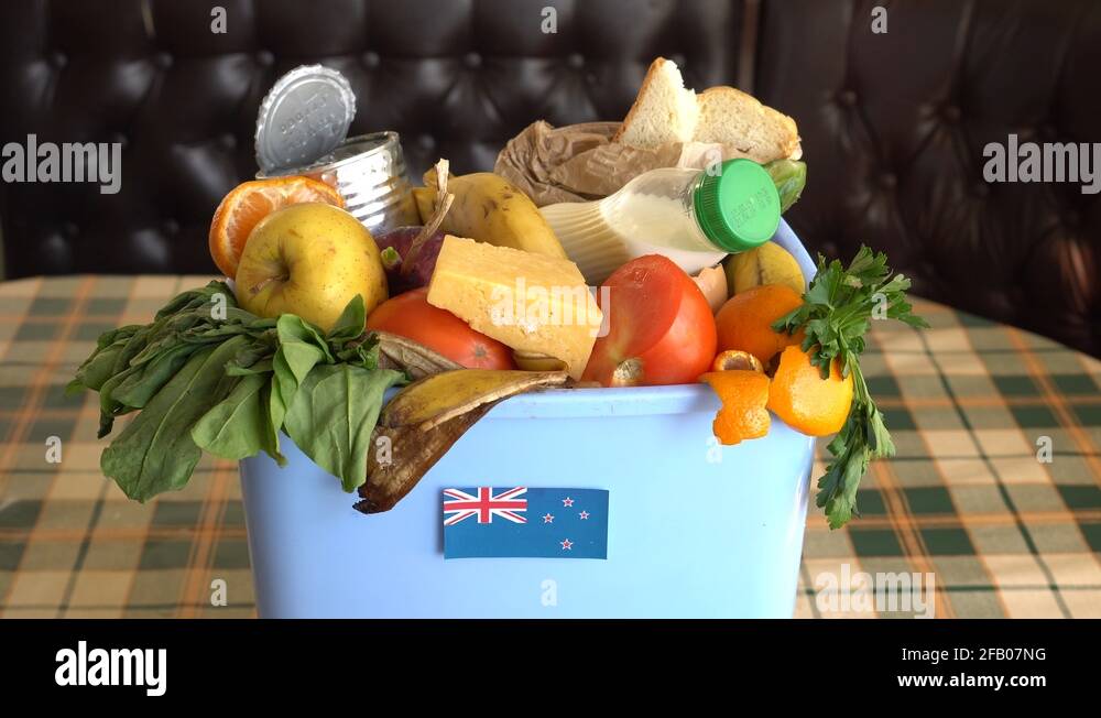 Food waste in Trash Can. The problem of food waste in New Zealand Stock