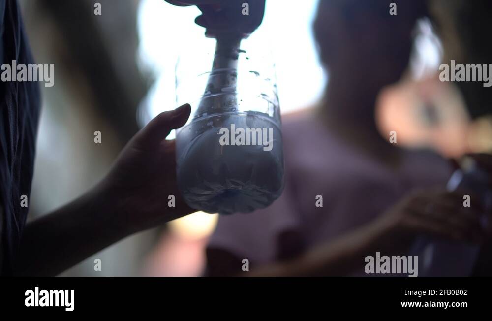Bokeh Linked Brushing A Girl Uses A Brush To Mix Water With Glue Stock Video Footage - Alamy
