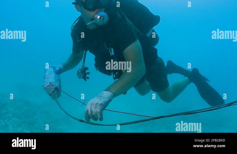 UCT2 and Royal Australian Navy diver conducting underwater demolition