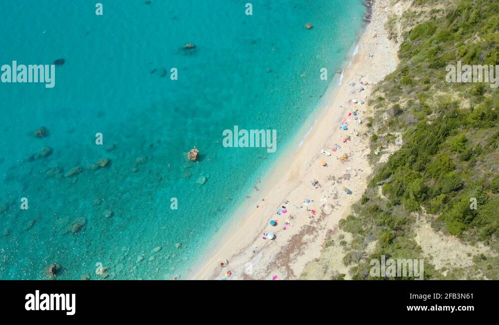 DRONE: Picturesque view of the stunning white sand beach in the ...