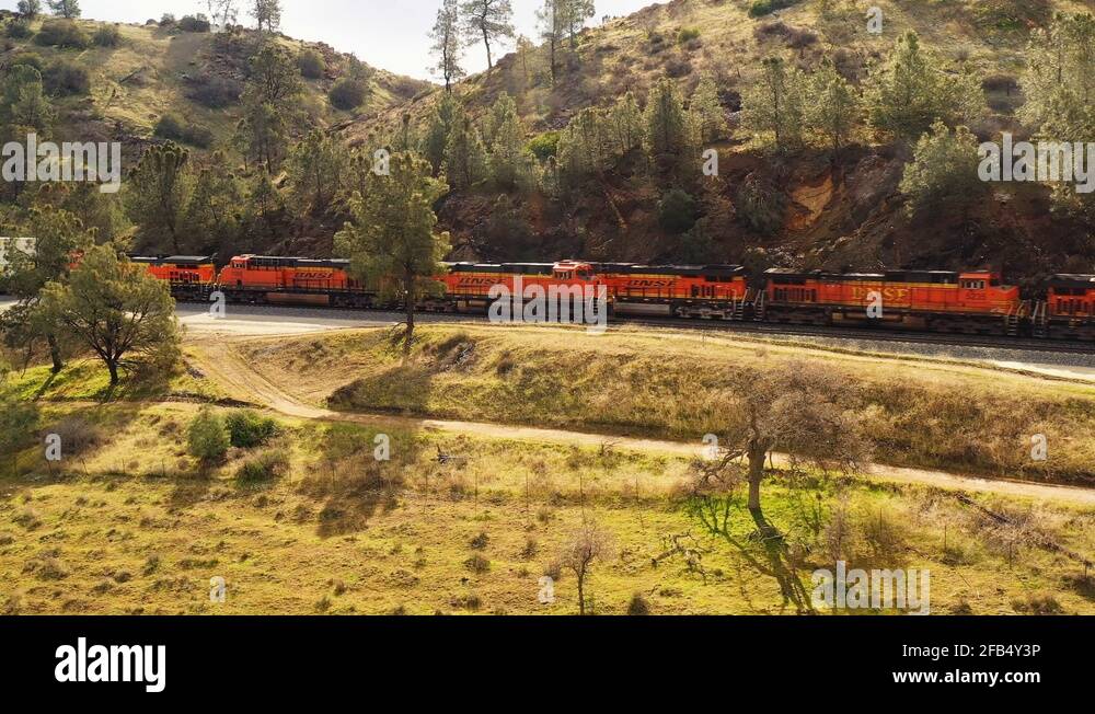 Two long freight trains pass each other at speed just south of the Stock Video Footage Alamy