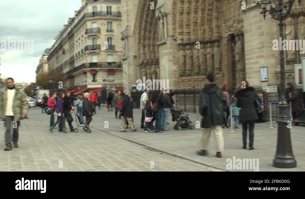 Pedestrian traffic in front of entrance to Notre Dame Cathedral in