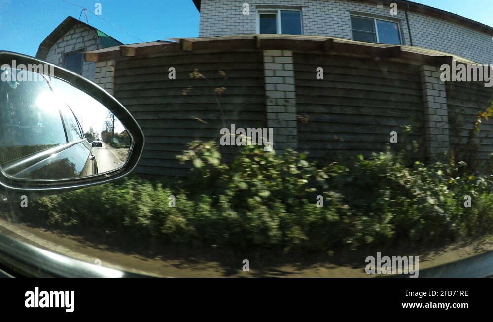 The view of the suburbs from the passenger seat window of the car Stock