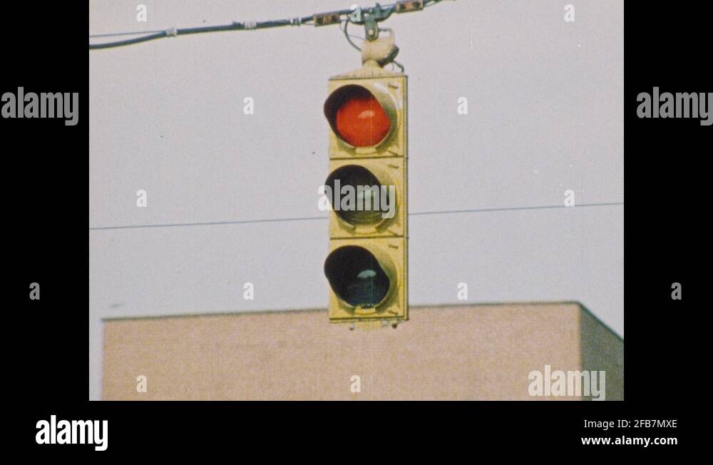 1970s UNITED STATES traffic light turns red. Amber traffic light