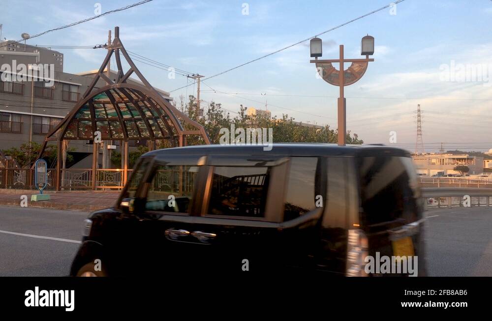 Cars Drive Over A Bridge With Stained Glass Archway. Urban Planning In