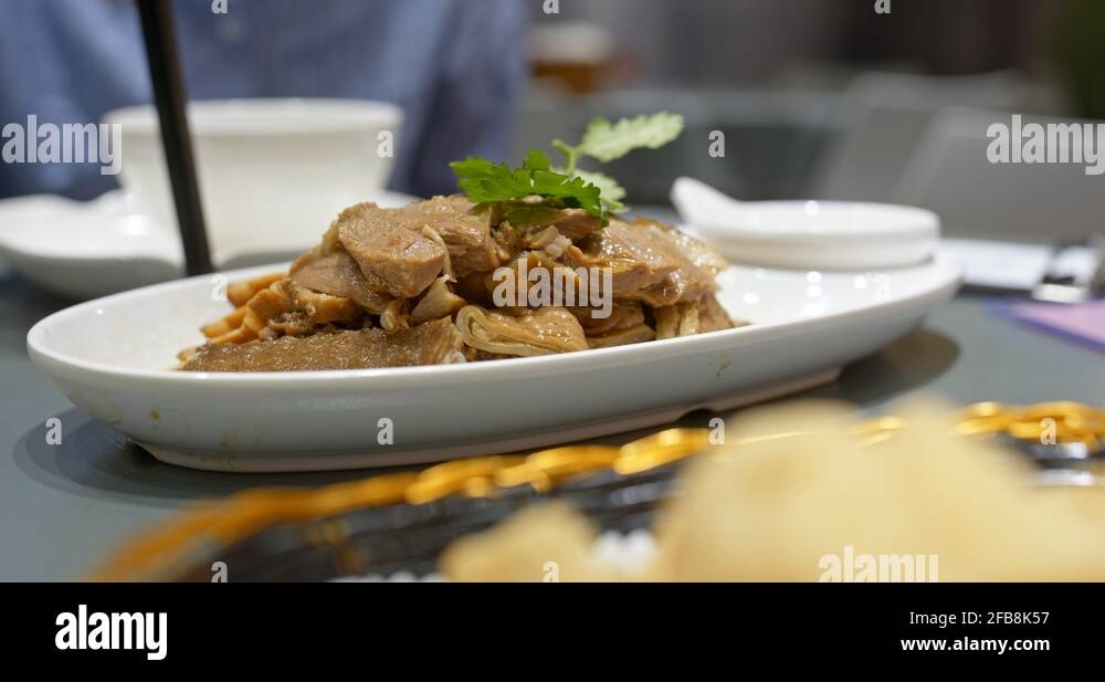Chinese dishes in restaurant, soy sauce goose and tofu Stock Video