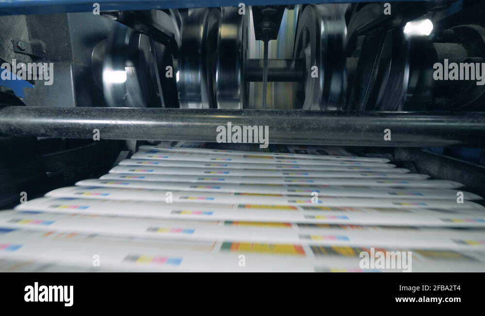 Print office machines moving newspaper on automated line Stock Video
