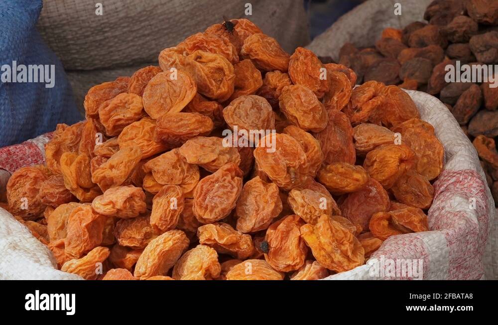 Dried apricot fruits at a market, Kargil, India Stock Video Footage - Alamy