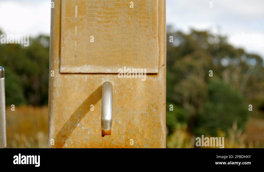 Wombat Flat Spring mineral water pump. TlLT DOWN SHOT with water