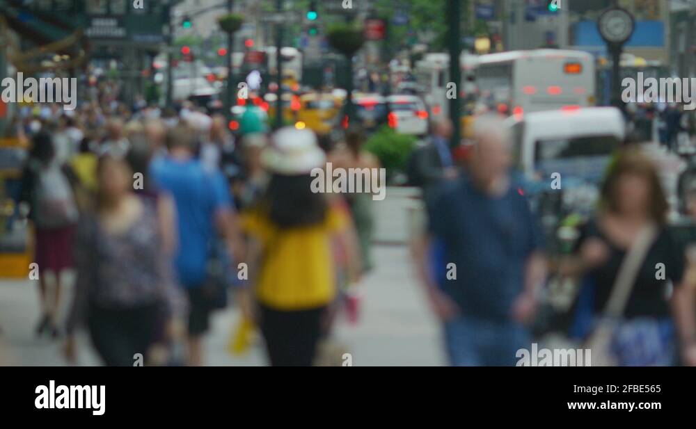 Crowd of people walking street slow motion backlit New York City slow ...