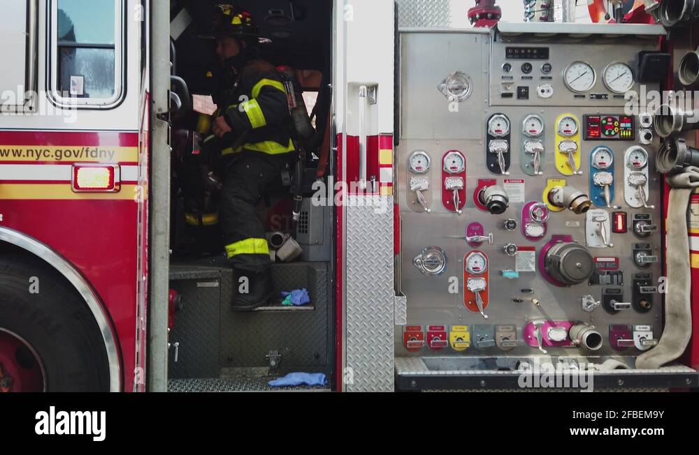 Fireman with AED exits a fire truck, Fire emergency in the Times Square