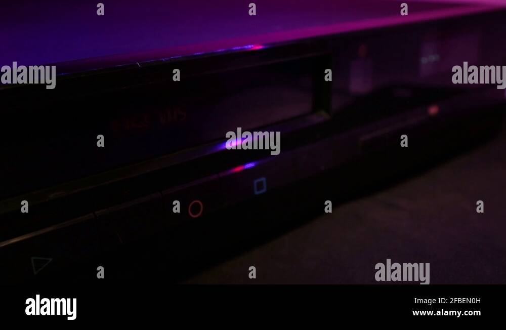 Inserting And Ejecting Wedding Day VHS Video Tape. Close Up Of A VCR