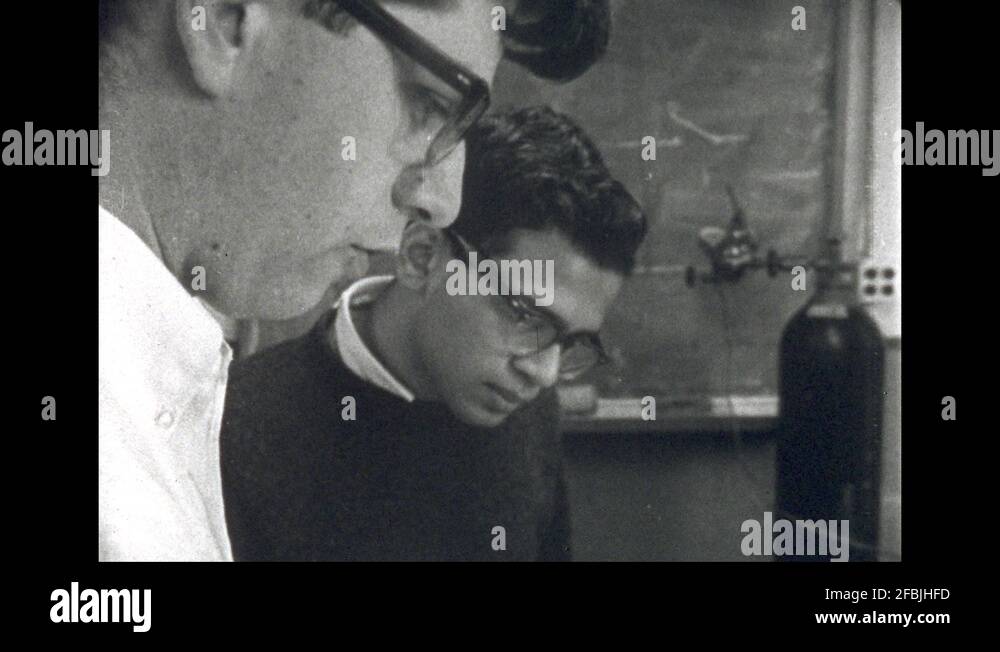 1960s: UNITED STATES: students talk about diagram. P Chamber. Counters ...