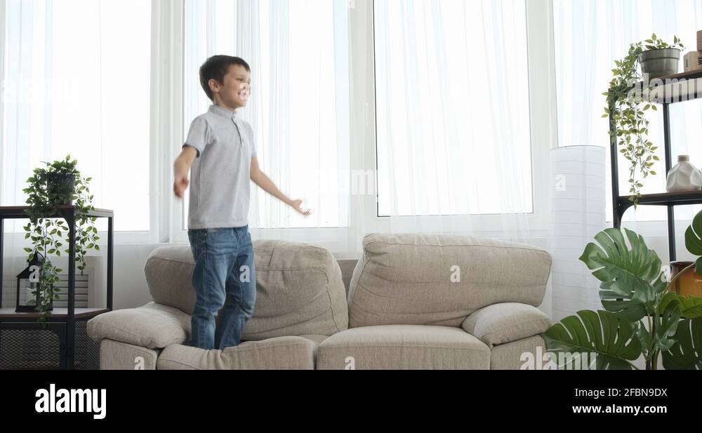 Boy jumping couch Stock Videos & Footage HD and 4K Video Clips Alamy