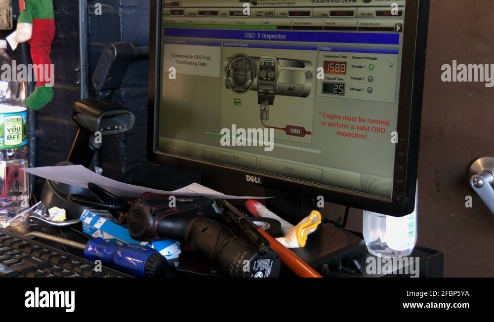 Vehicle emissions inspection being performed on Toyota. OBD inspection