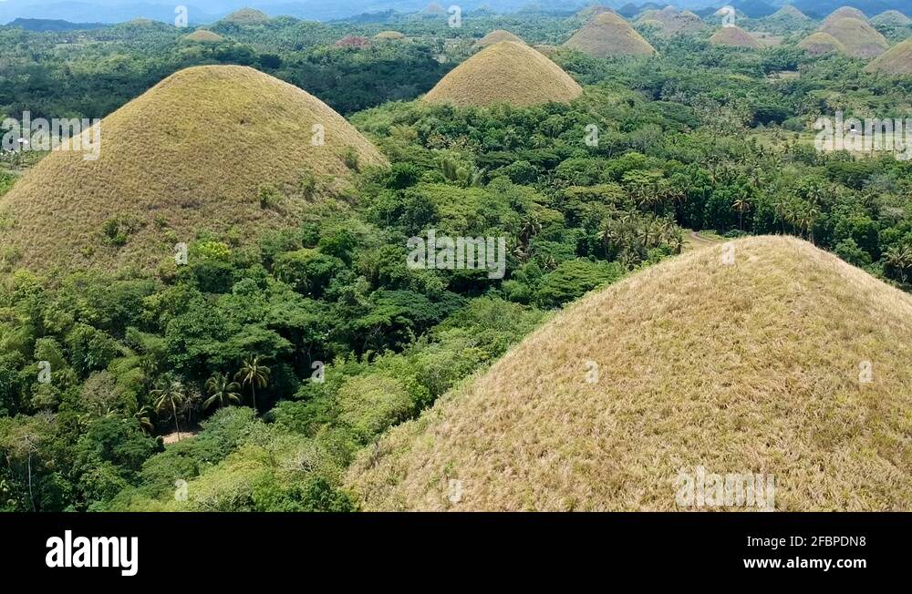 Aerial parallax reveal of chocolate hills. Chocolate Hills viewing