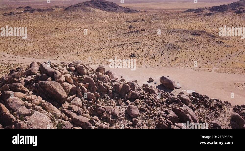 drone pedestal up Revealing Wide Shot Of Mojave Desert With Of Yucca