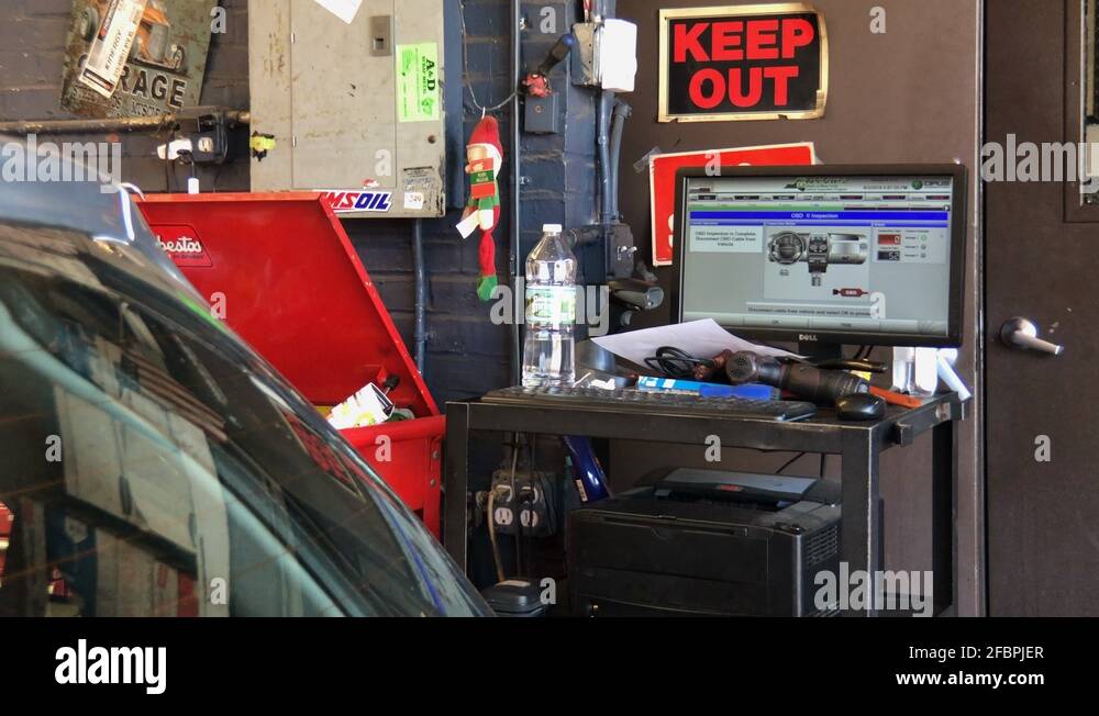 Vehicle emissions inspection being performed on Toyota. OBD inspection