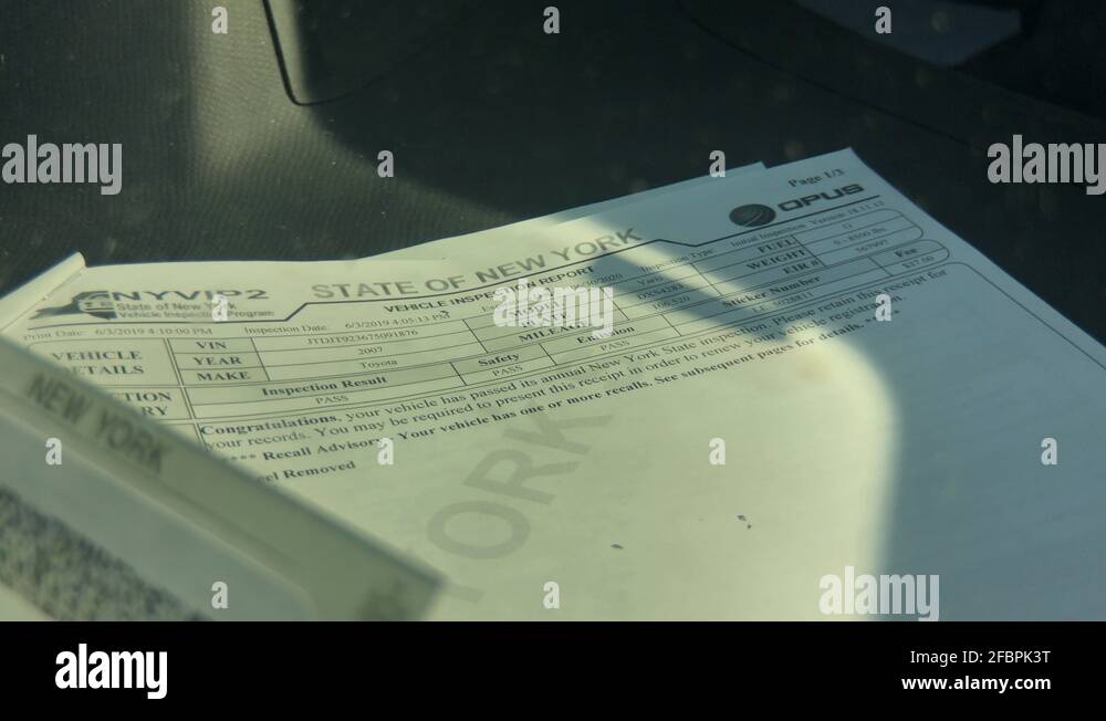 Vehicle emissions inspection being performed on Toyota. Print out of