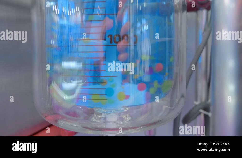 Laboratory mixer by impeller is mixes the blue solution in a large flask Stock Video Footage Alamy