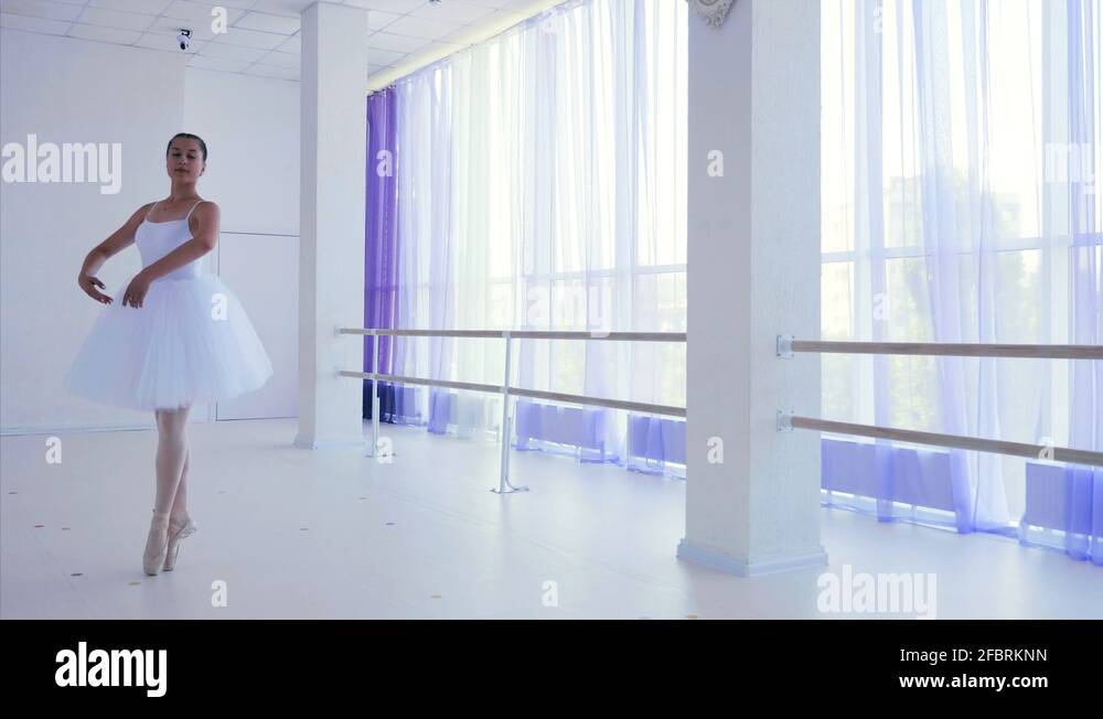 Ballerina performances ballet dance element epaulement croise in ballet class Stock Video