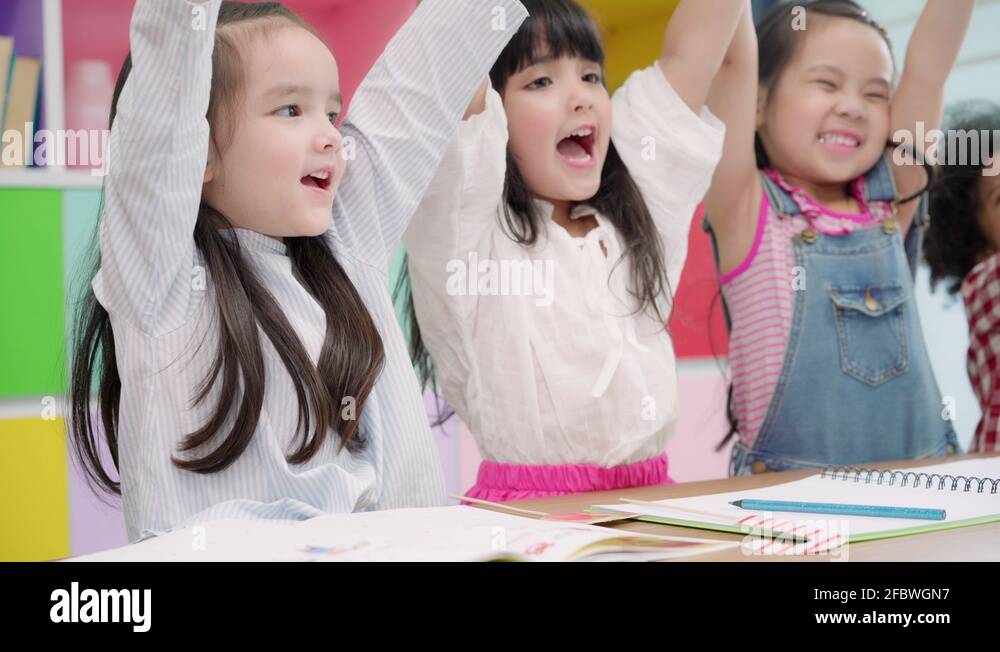 Group of children drawing in classroom Stock Video Footage - Alamy