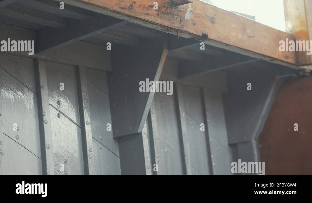 Worker painting wooden hull of boat Stock Videos & Footage HD and 4K