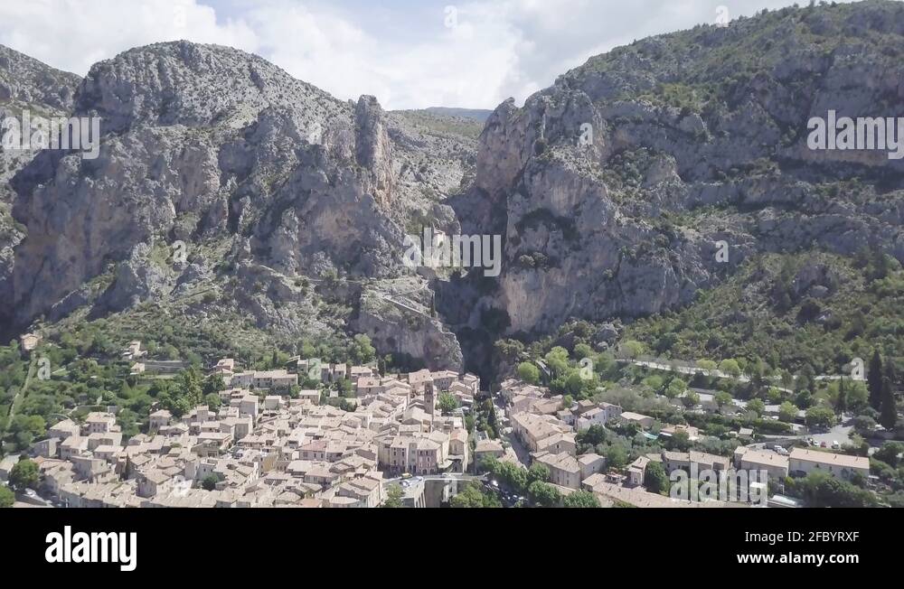 Drone flying dolly out reveal village of Moustiers at the bottom of