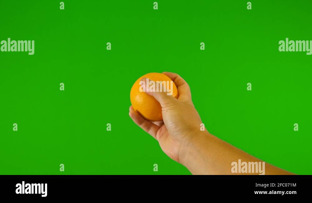 orange with green background throwing up orange with green screen