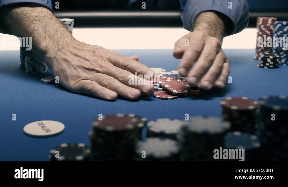 Successful player stacking his chips on the poker table Stock Video