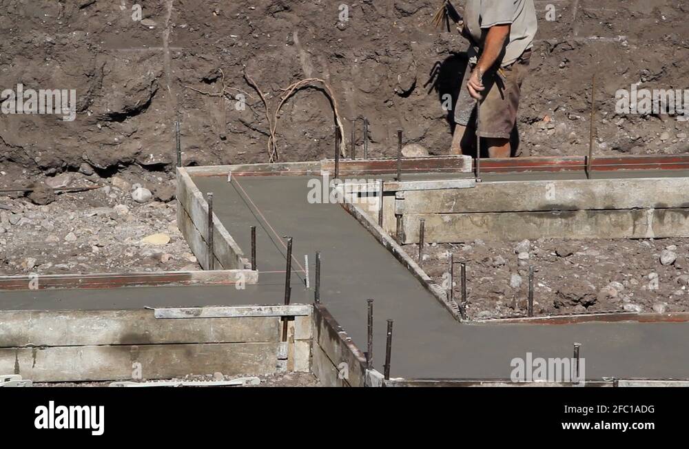 Putting Rebar into Cement Footings Stock Video Footage Alamy