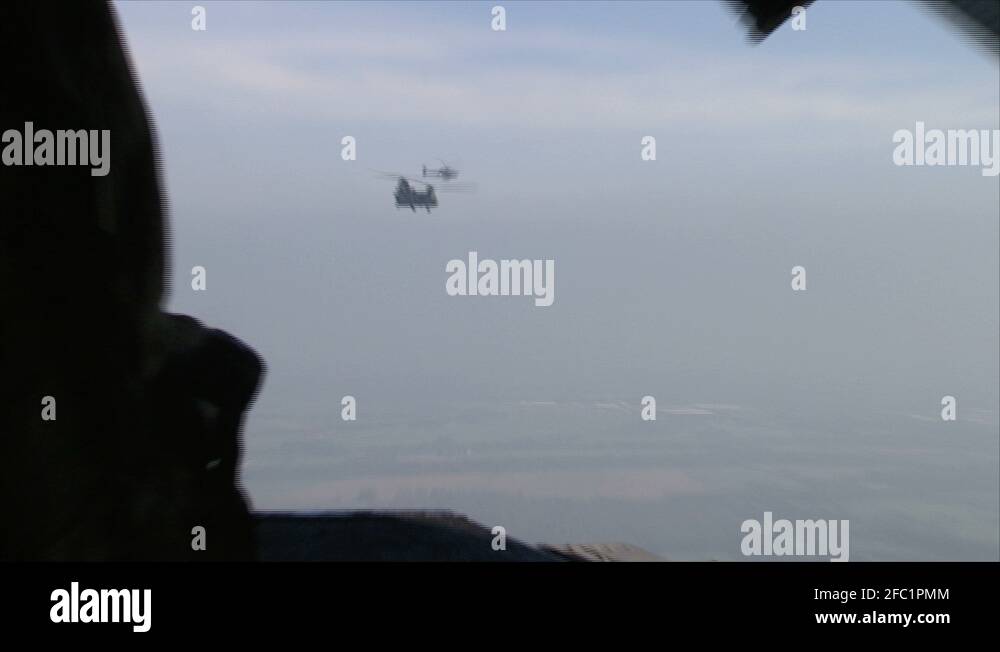 air to air on the ramp of a chinook helicopter with shots of the tail ...